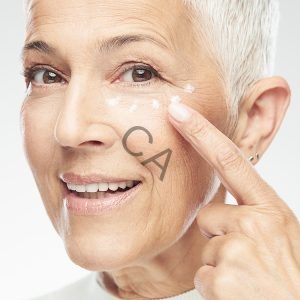 Older woman using skincare products to help with age lines
