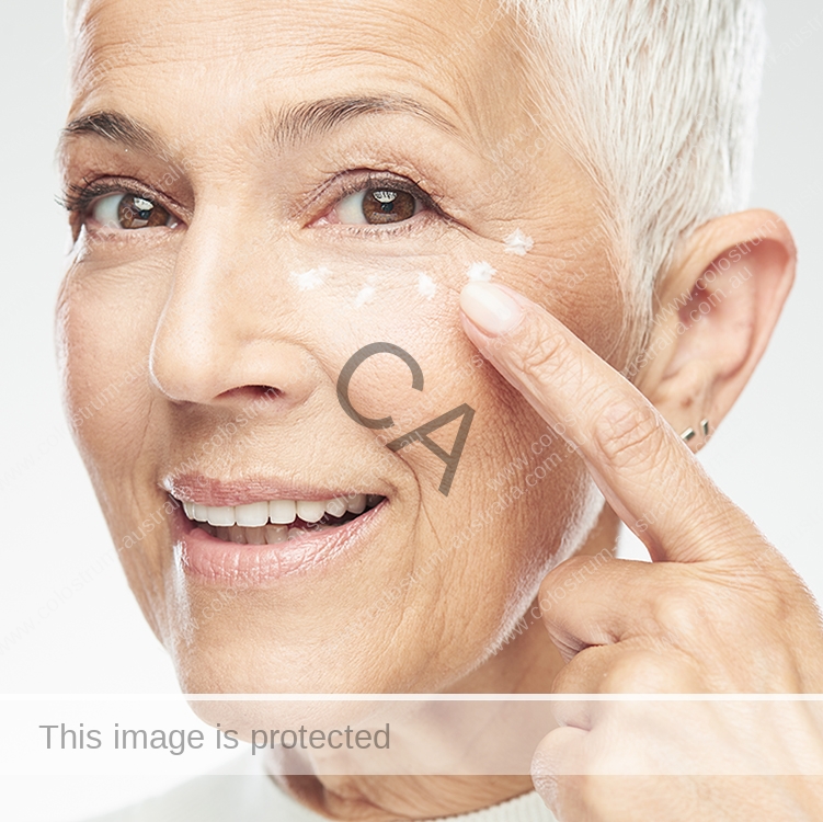 Older woman using skincare products to help with age lines